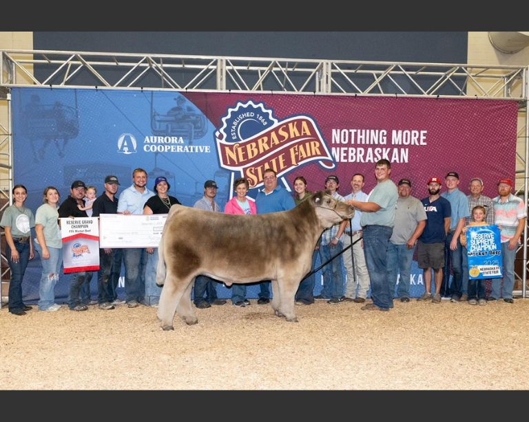 Reserve supreme champion market steer shown by Adam Alfs, with family and supporters at the 2025 Nebraska State Fair